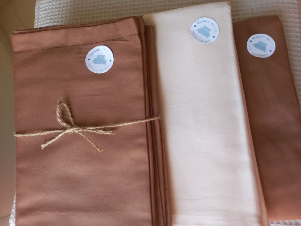 Terracotta and ivory bed sets packaged and labelled Maison de l'île